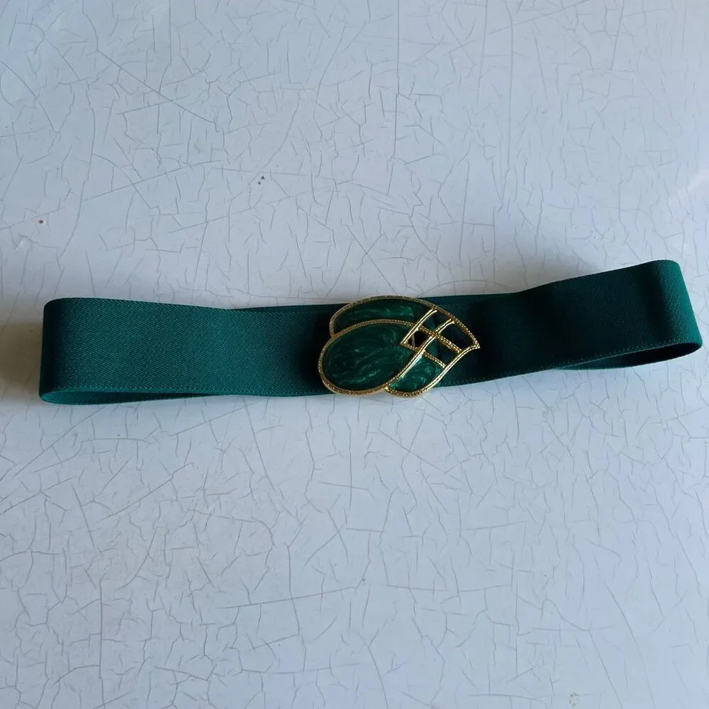Day-lor usa Vintage elastic belt features a distinctive two-piece green enamel a
